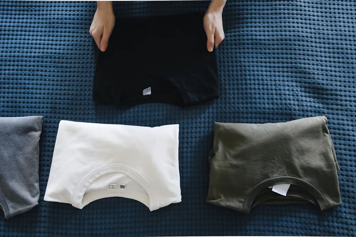 wrinkled t-shirt pile collapsing in drawer