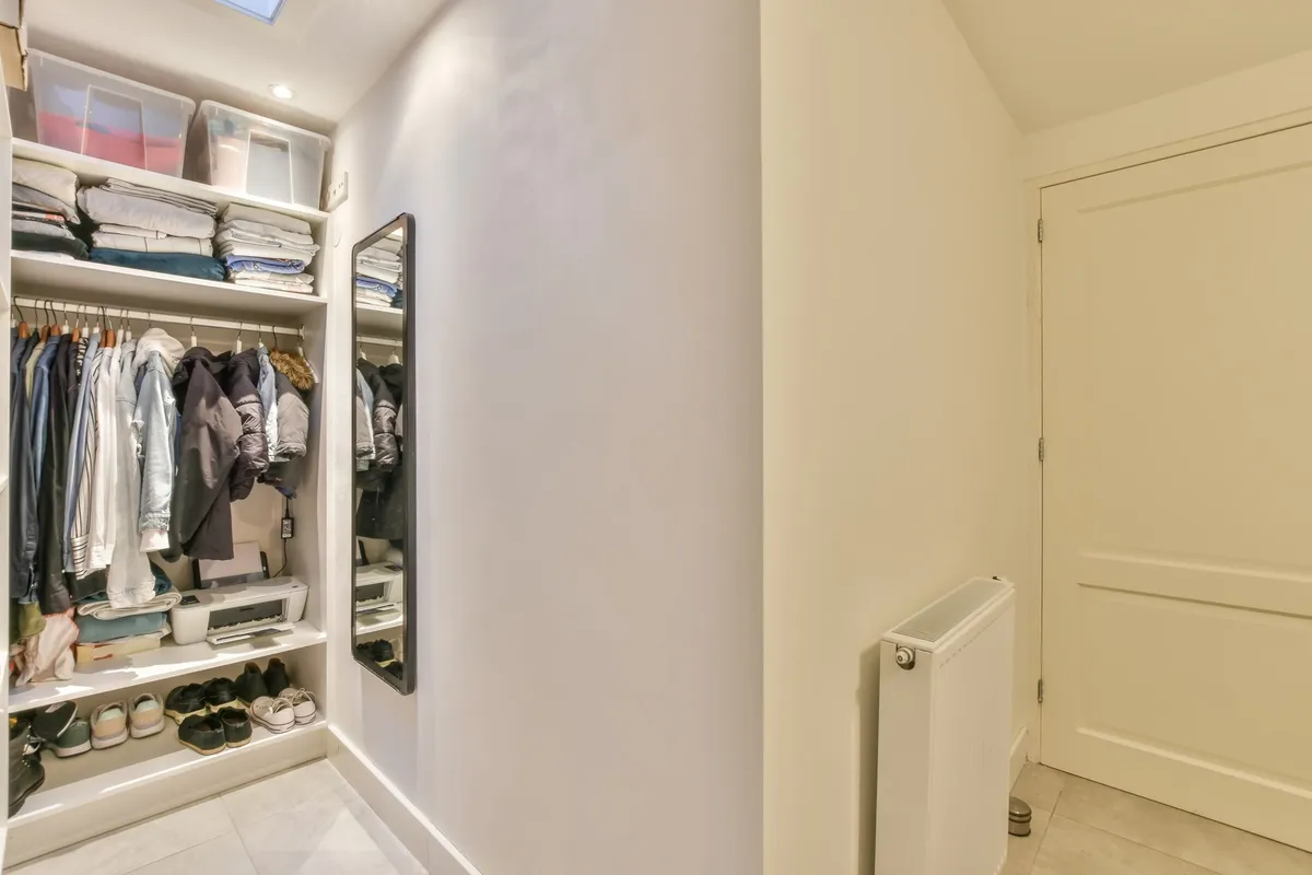 cascading hangers holding five blouses vertically stacked