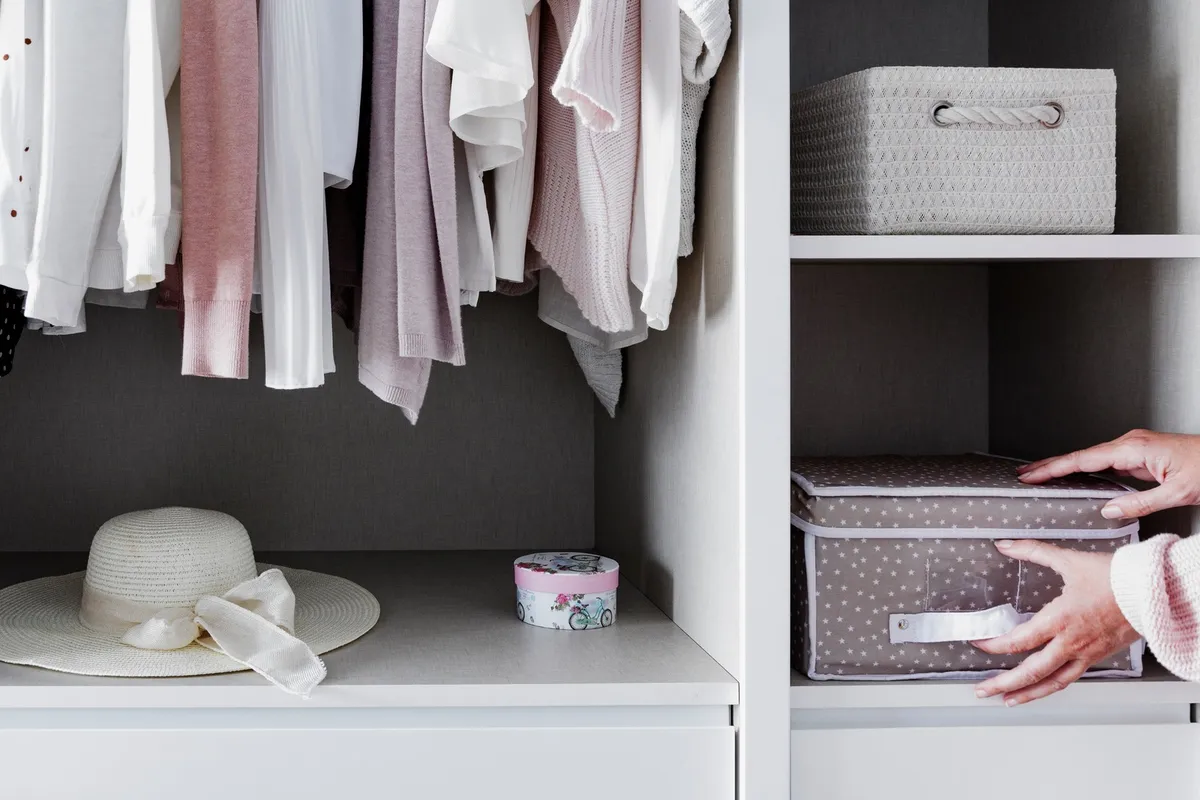 organized garage shelving with labeled clear storage bins