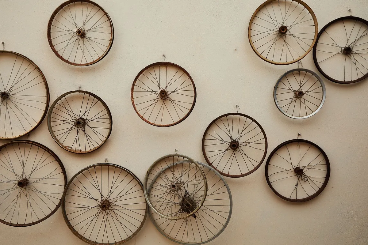 freestanding floor rack holding three bikes upright