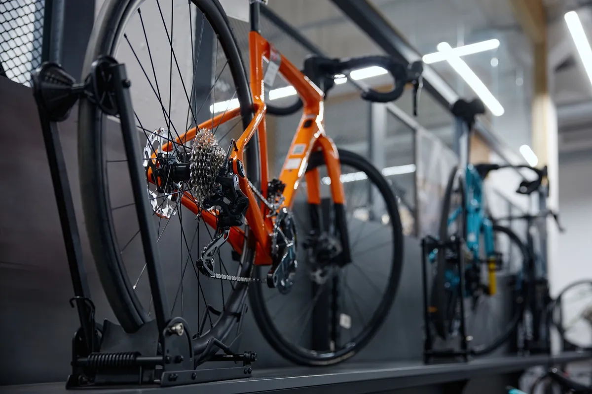 pegboard wall with bike hooks and bike frame hanging