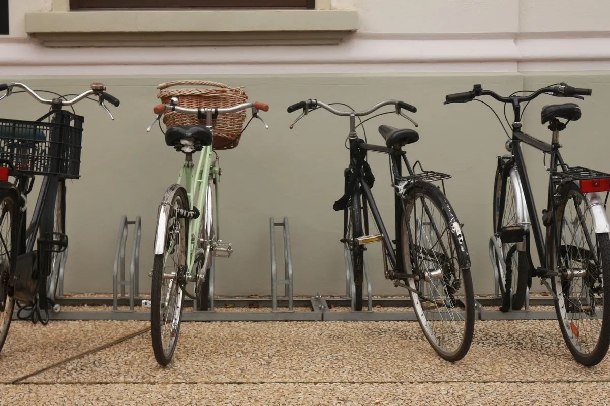 single bike stand holding commuter bike in entryway