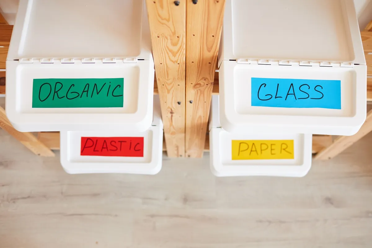 heavy-duty metal shelving unit against garage wall with labeled storage bins