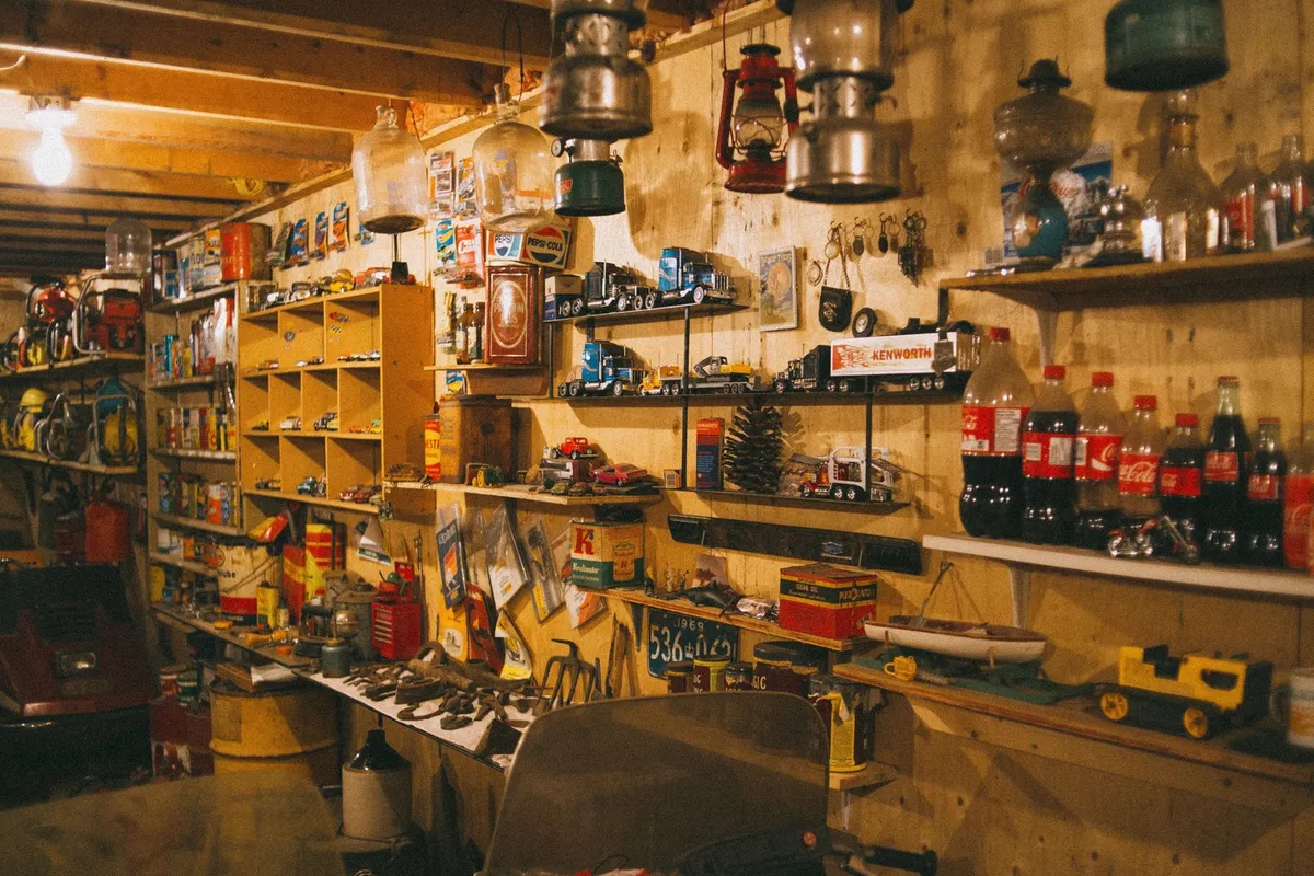 heavy-duty metal shelving unit against garage wall with labeled storage bins