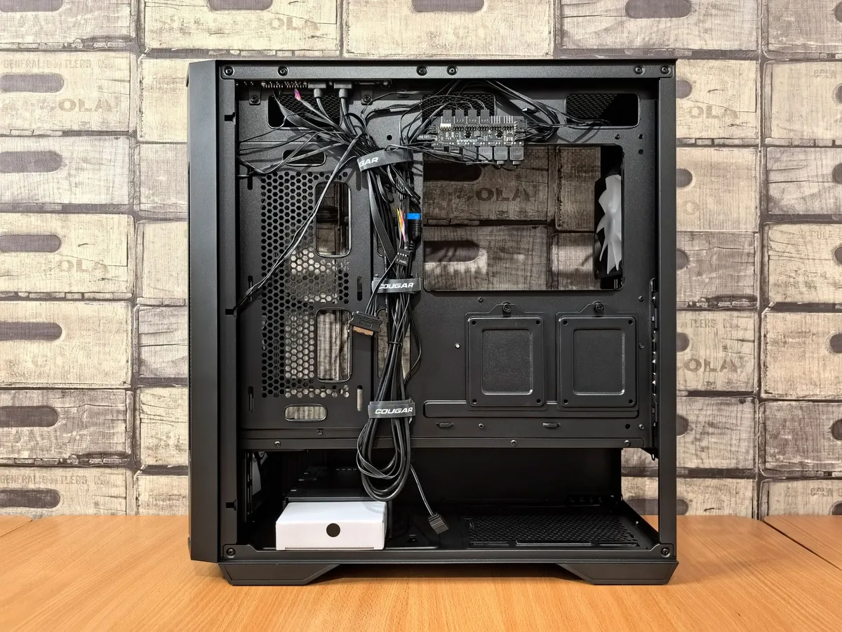 under-desk cable tray holding bundled cords neatly