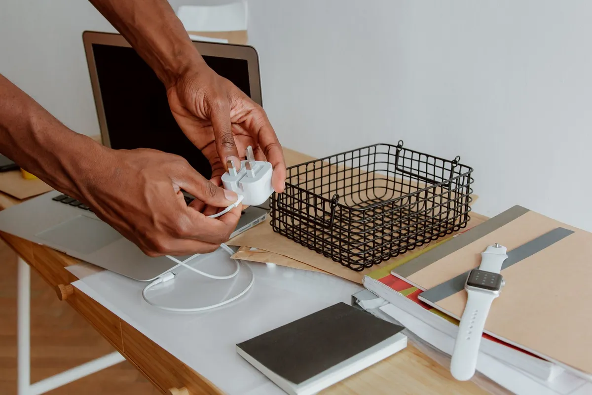 pegboard above desk with hooks headphones and small shelves