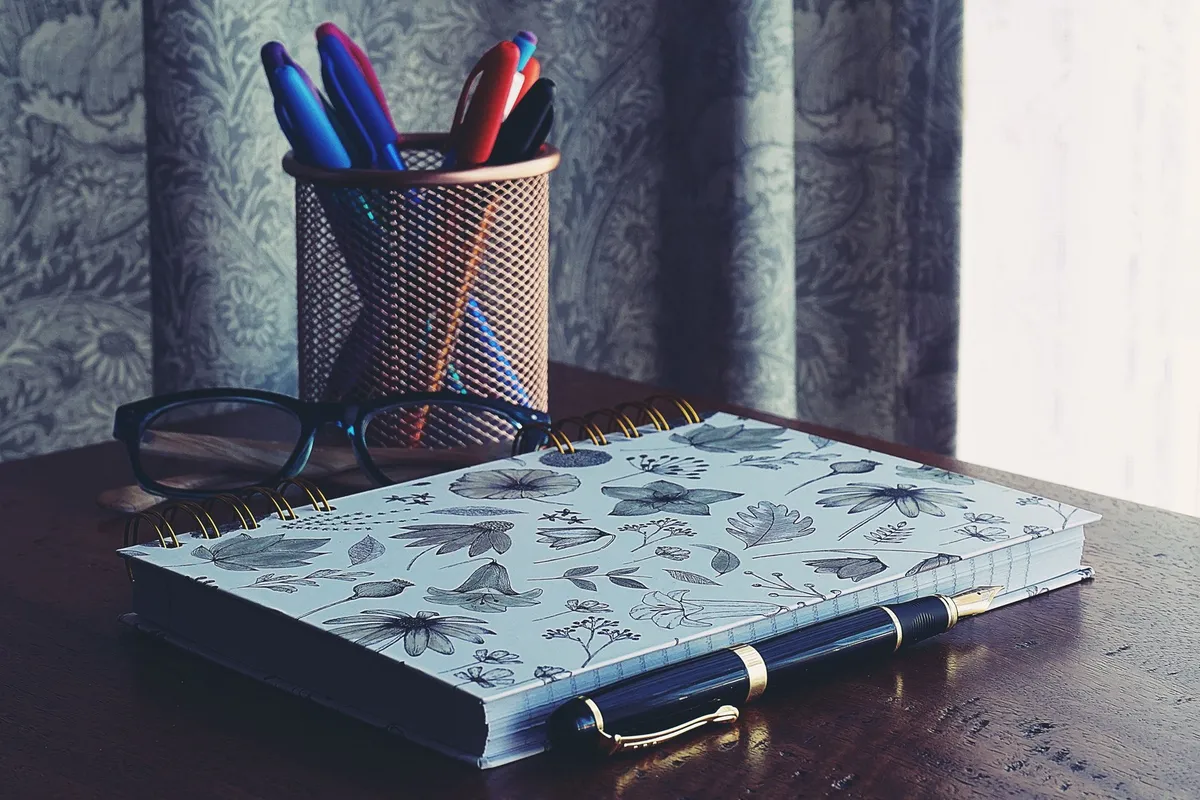 desk drawer with bamboo dividers pens sticky notes and paper clips