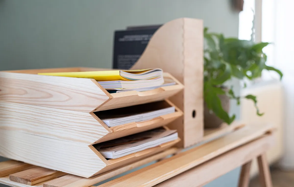 tidy wooden desk with tray organizer and single pen cup