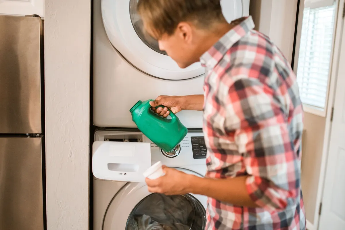 front load washer drum with grimy rubber door gasket visible