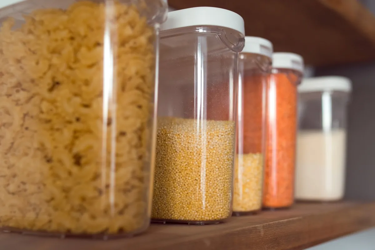 clear rectangular containers stacked in refrigerator with vegetables