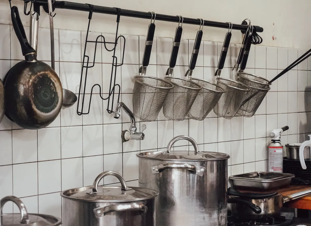 over-sink dish rack holding dishes above basin
