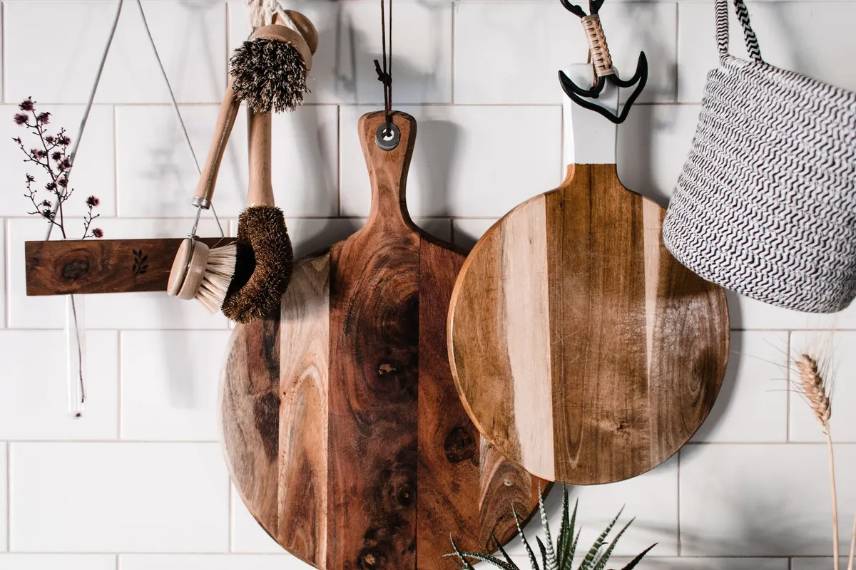magnetic knife strip mounted on white kitchen wall with knives