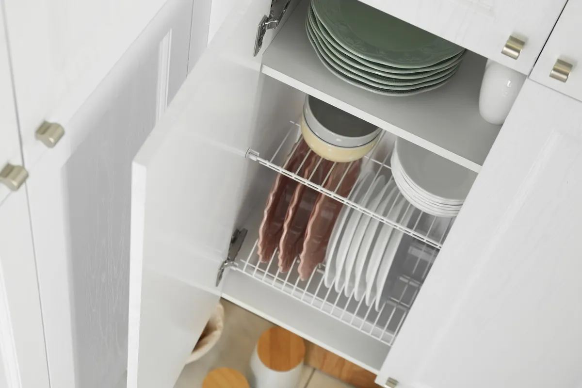 pull-out pantry tower extended from wall cabinet space showing tiered shelves