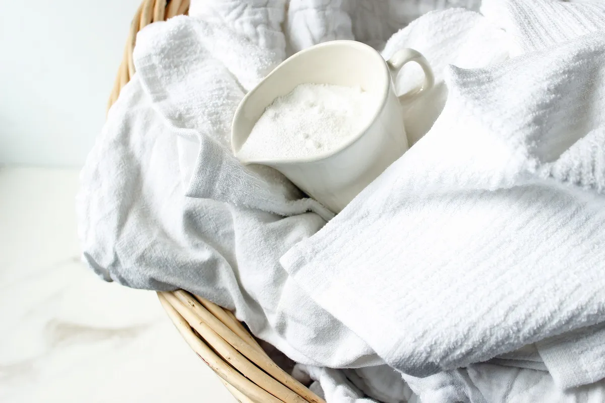 mason jar of homemade powder laundry detergent with scoop