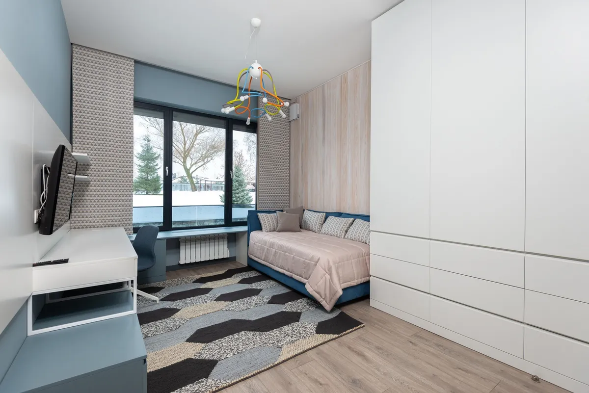 platform bed frame with open storage drawers and folded linens