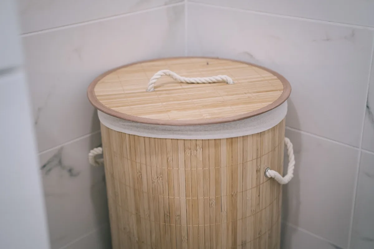 wall mounted fold down ironing board in narrow laundry room