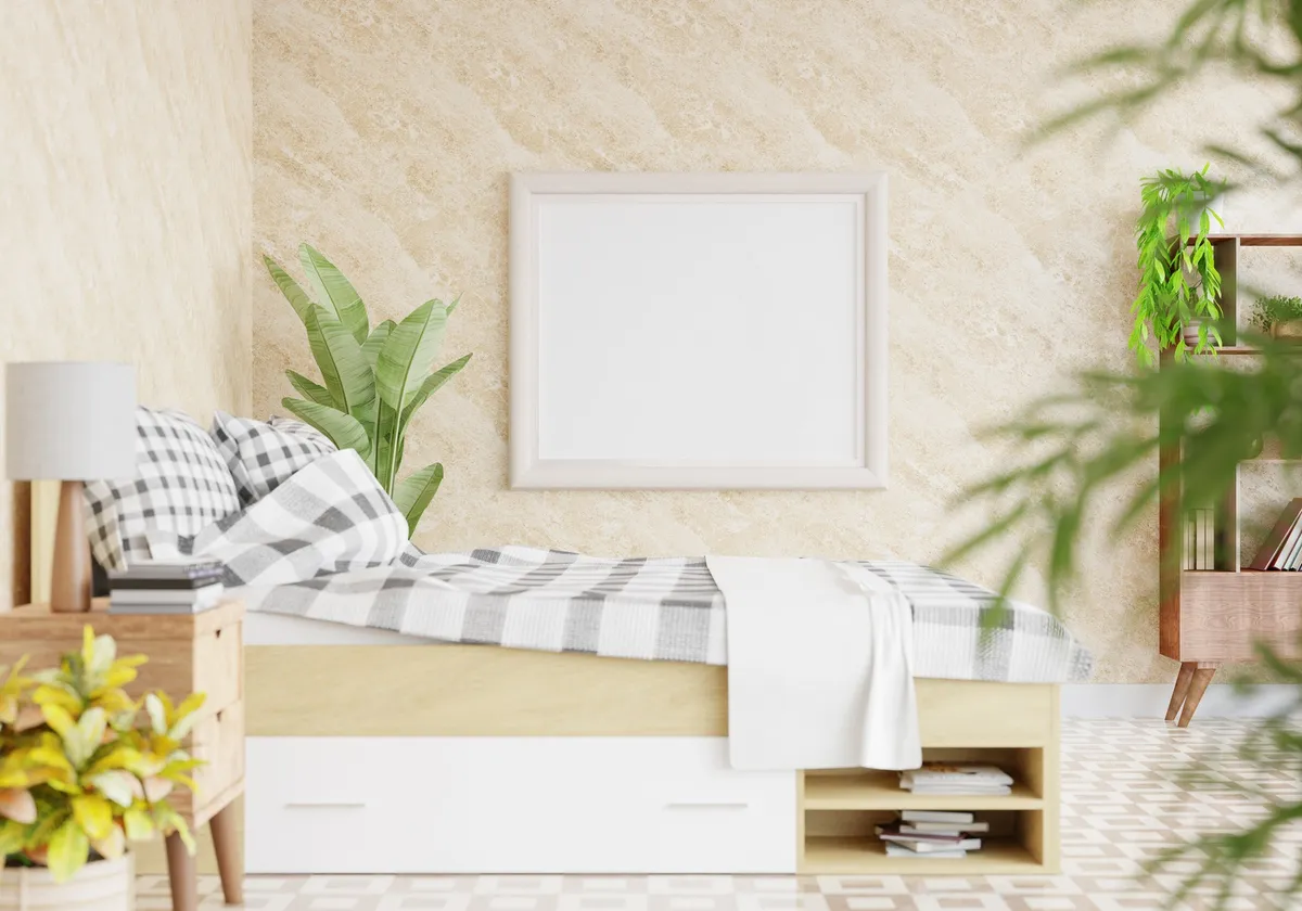 bed with shelved headboard holding books and small lamp