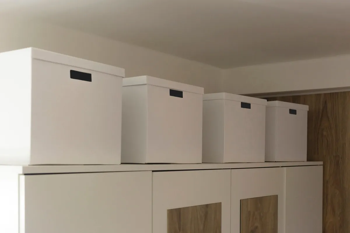 platform bed with open storage drawer revealing folded clothing