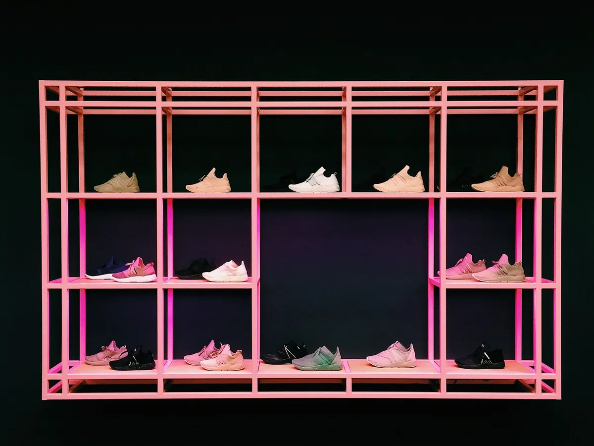 angled wall-mounted shoe rack in narrow hallway