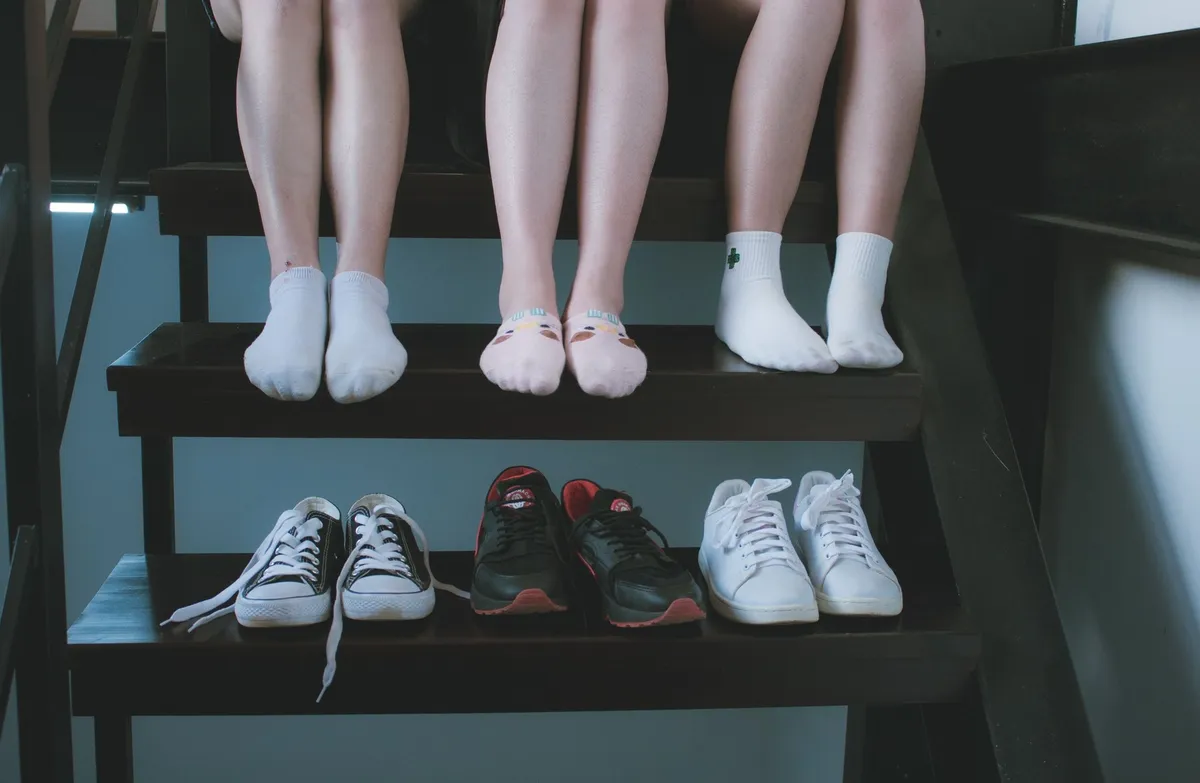 woven baskets holding shoes near front door