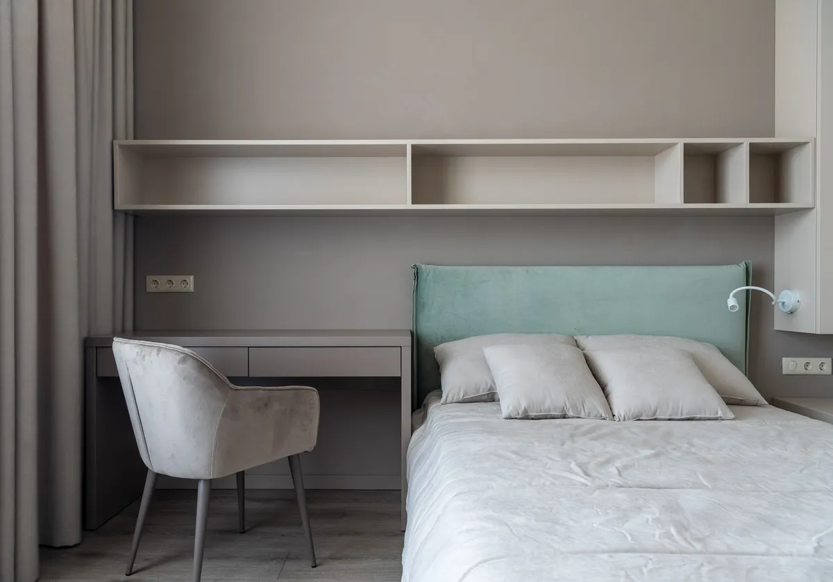 platform bed with open storage drawer revealing folded clothing
