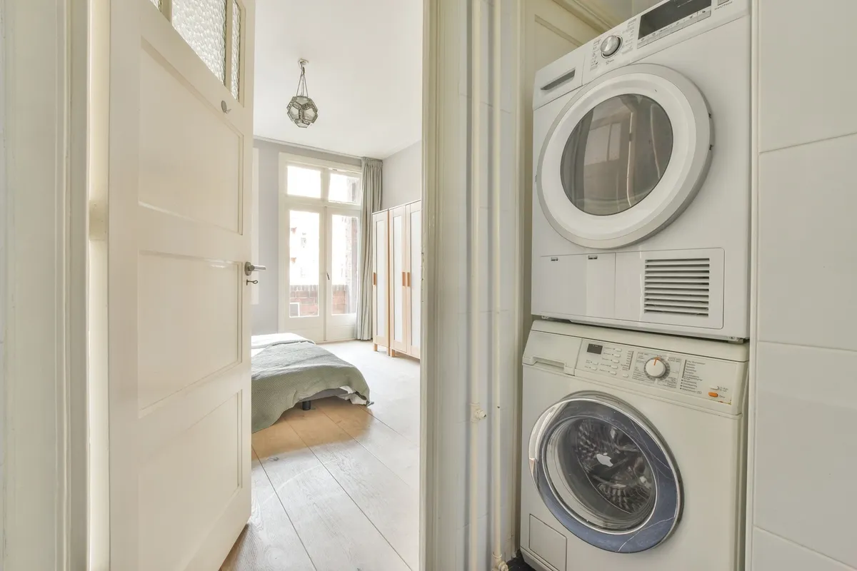 wooden countertop cover over washer dryer folding station